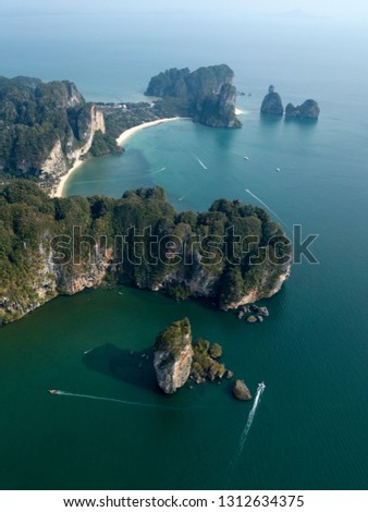 Aerial photo of Ao Nang beach in Krabi, Thailand. Thailand landscape with beach, green rocks, sand and boats on the sea.