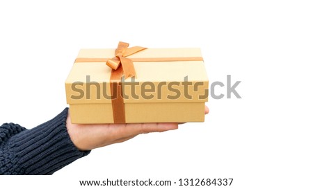 Man holding a gold gift box on a white background.