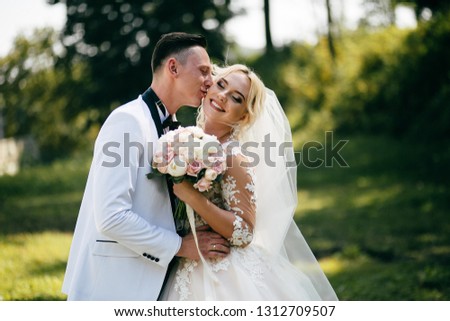 The bride and groom in nature