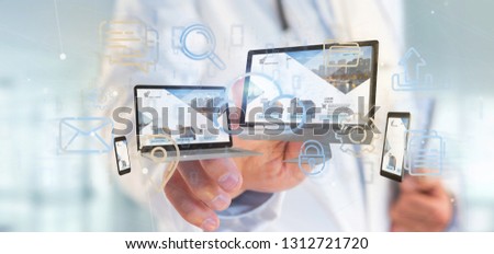 View of a Doctor holding a Devices connected to a cloud multimedia network 3d rendering