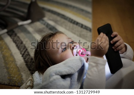 Baby using phone.