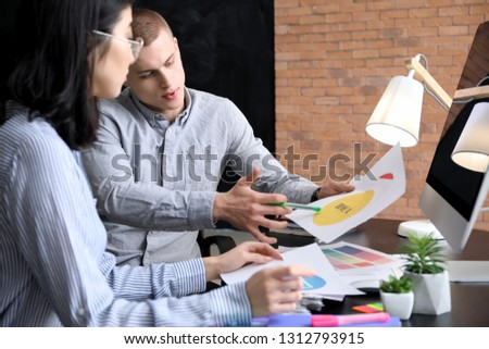 Designers working on new logo in office