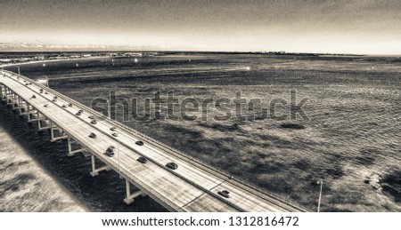 Aerial view of Rickebacker Causeway with car traffic.