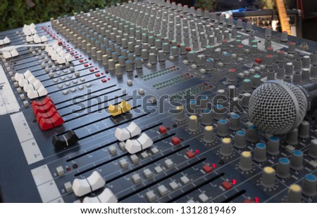 sound mixing table for a concert with microphone