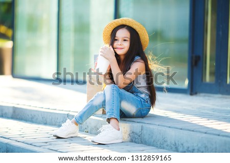little model girl posing on the street