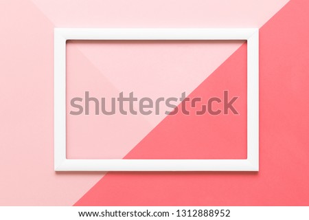 Abstract geometrical coral and pastel pink paper flat lay background. Minimalism, geometry and symmetry template with empty picture frame mock up.