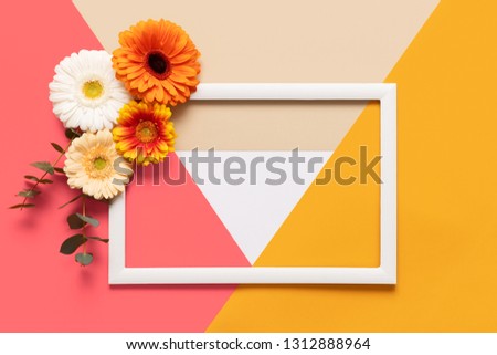 Happy Mother's Day, Women's Day, Valentine's Day or Birthday coral colored Background. Coral flat lay greeting card template with beautiful gerbera flowers.