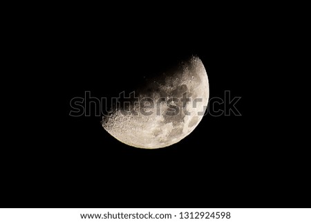 Half of the moon  image at night.