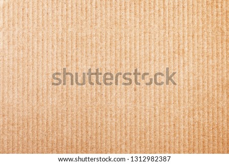 Brown corrugated cardboard stripes. Shipping box closeup pattern texture.