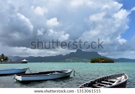 Tropical Island Boat image. Mahebourg. Mauritius landscape with sea. Coast with clouds. Summer landscape photography. Indian Ocean images