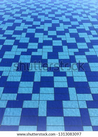 Light blue and blue rectangular pool tiles pattern