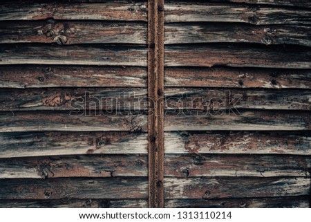 Wooden old door texture, grunge background. Brown and red colors