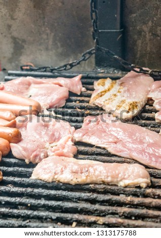 Meat roasting on a barbecue