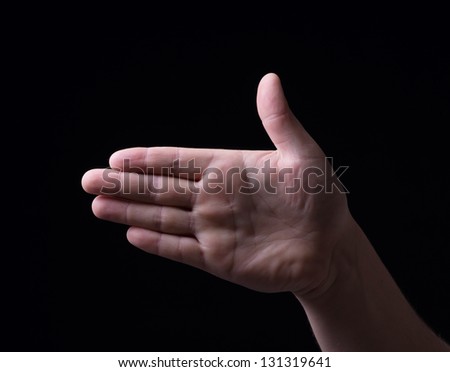Hand on a black background
