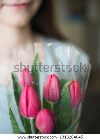 girl woman holding a bouquet of flowers tulips