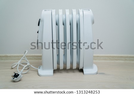 Electric oil heater, oil-filled radiator on the floor