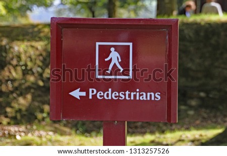 Sign informing pedestrians which way to go.