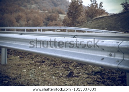 Steel guard rail barrier on the motorway without reflective sign