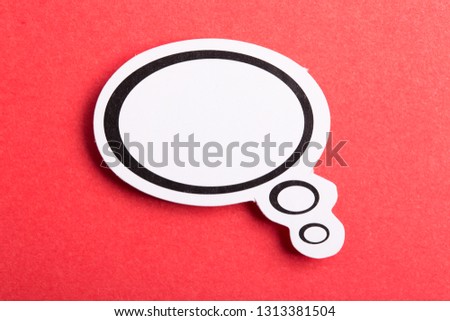 Blank white speech bubble isolated on red background.