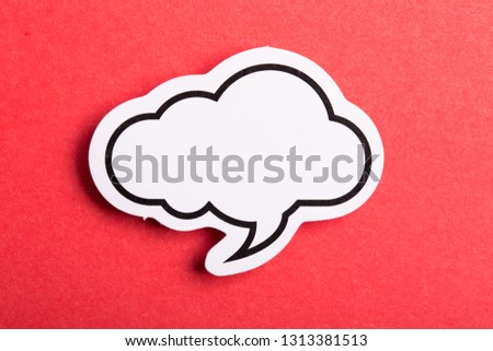 Blank white speech bubble isolated on red background.