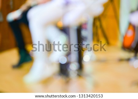 Royalty high quality free stock photo of abstract blur and defocused of the artists on stage, one of them wears white color