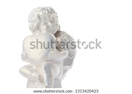 Cherub statue isolated on white background. Angel holds the heart. Love Valentine's Day