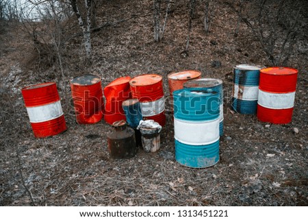 old abandoned barrels in the forest pollution