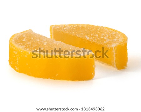 Two marmalade lemon slices on a white background