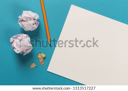 Pencils with sharpening shavings with white paper sheets on coloured backgroung, Office tool, rolled paper