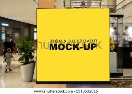 Mock up square shape of blank billboard with clipping path for promotion or announcement on panel at corridor of entrance, yellow screen empty space for insert text or advertising in shopping mall
