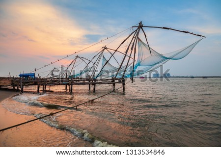 Chinese fishing nets or cheena vala are a type of stationary lift net, located in Fort Kochi in Cochin, India Royalty-Free Stock Photo #1313534846