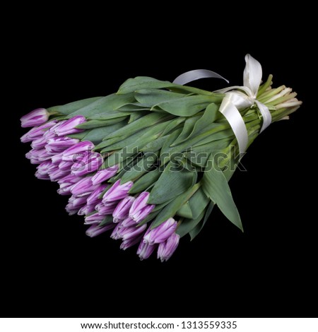 bouquet of tulips carved on a black background