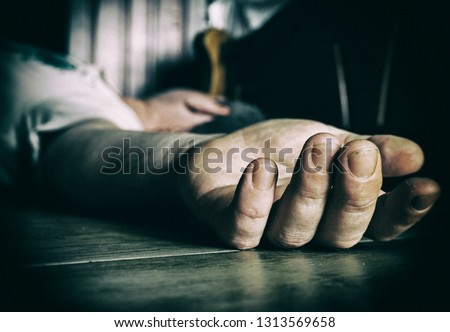 Dead or drunk man on the floor Royalty-Free Stock Photo #1313569658