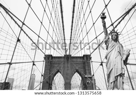 Statue of Liberty and Brooklyn Bridge in New York put together in photoshop