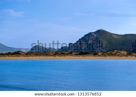 sea landscape and view of the coast with hills or mountains against the background of the sky