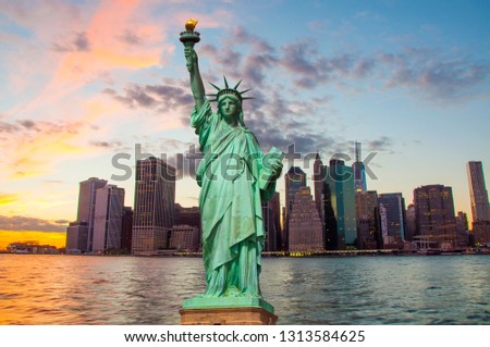 Statue of Liberty and New York skyline together 