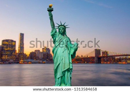 Statue of Liberty and New York skyline together 