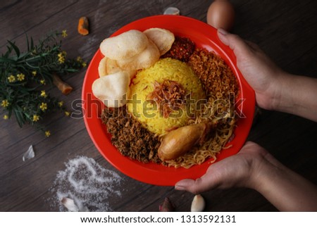 it is call "Nasi Kuning Ternate"...mmmmm Royalty-Free Stock Photo #1313592131