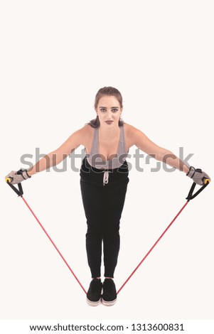Fitness model posing depicting a exercise and healthy lifestyle on a white background using different types of fitness equipment