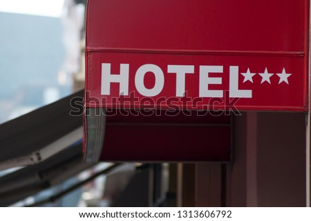 closeup of hotel sign on building face