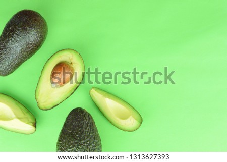 healthy food,fresh avocado on green background with copy space