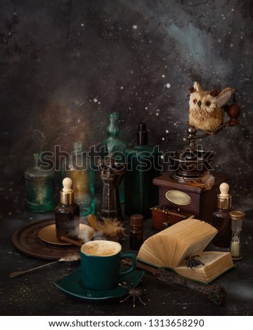 Magic coffee on the table. Spiders, potions and a magic wand for the mage. Royalty-Free Stock Photo #1313658290
