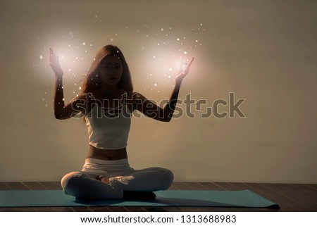 Yoga meditation woman pose with seven chakras, aura, spiritual. Royalty-Free Stock Photo #1313688983