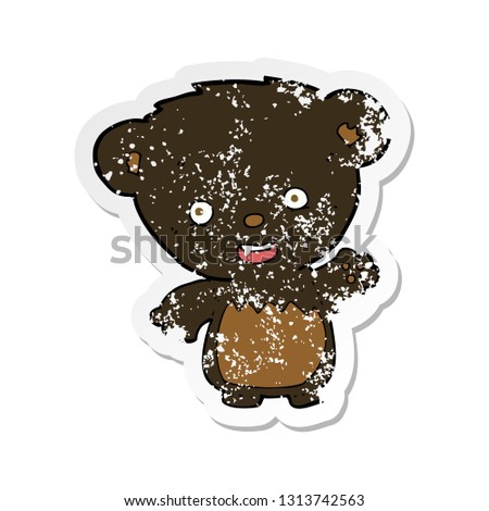 retro distressed sticker of a cartoon black bearcub waving