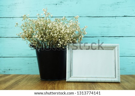 space photo frame with dried flower in metal flower pot