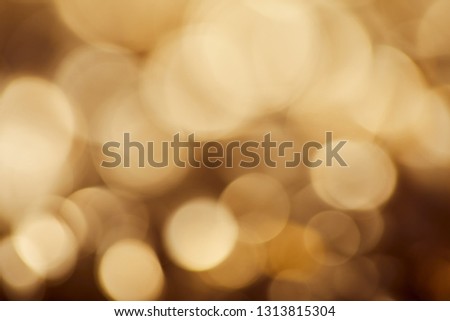 bright brown background with golden sparkling lights