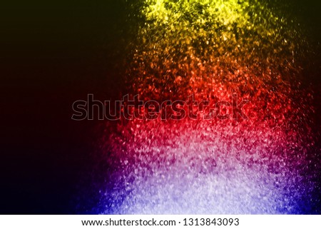 Multicolor powder explosion on black background. Colored cloud. Colorful dust explode. Paint Holi. 