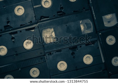 Dubai, uae - feb 14, 2019: stack of old VHS video tape cassette . top view photo. retro style background image