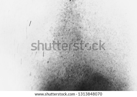 Dust splash cloud isolated on white background. Freeze motion of black powder exploding. Paint Holi. 