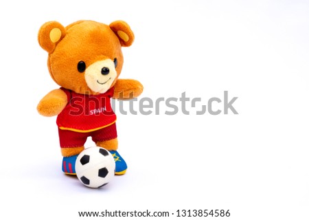 Teddy bear athlete Spain player with ball isolated on white background.